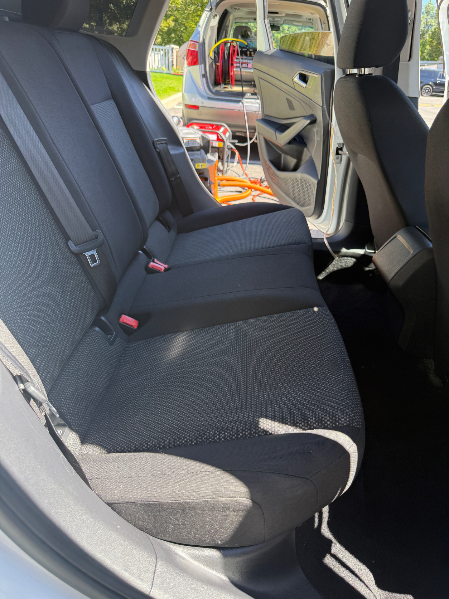 Rear car seats before and after a deep clean and extraction — after
